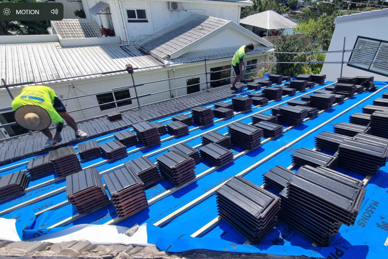 residential-tile-reroof-north-brisbane Roofing professional completing tile re-roof work on a roof in North Brisbane