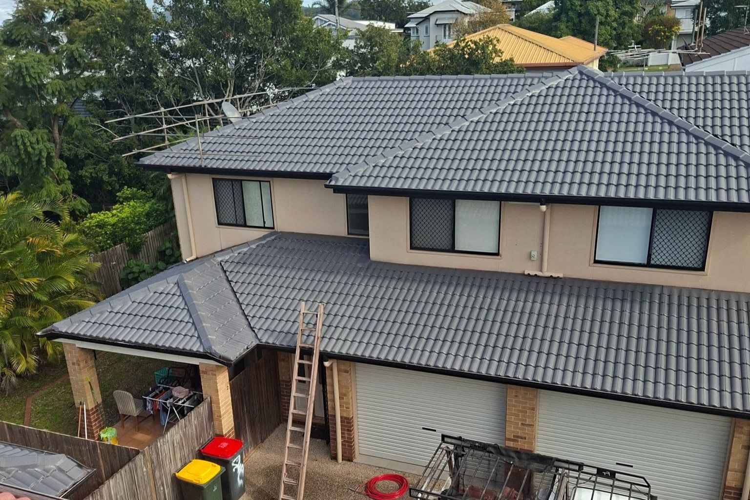 grey-tiled-roof-restoration-north-brisbane Grey tiled residential roof following professional restoration work in North Brisbane