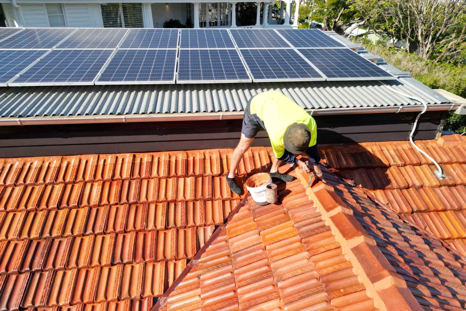 Roof repointing work being completed on a tiled roof